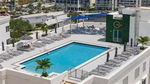 a view of a swimming pool with outdoor seating