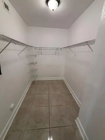 a view of a room with racks on the wall