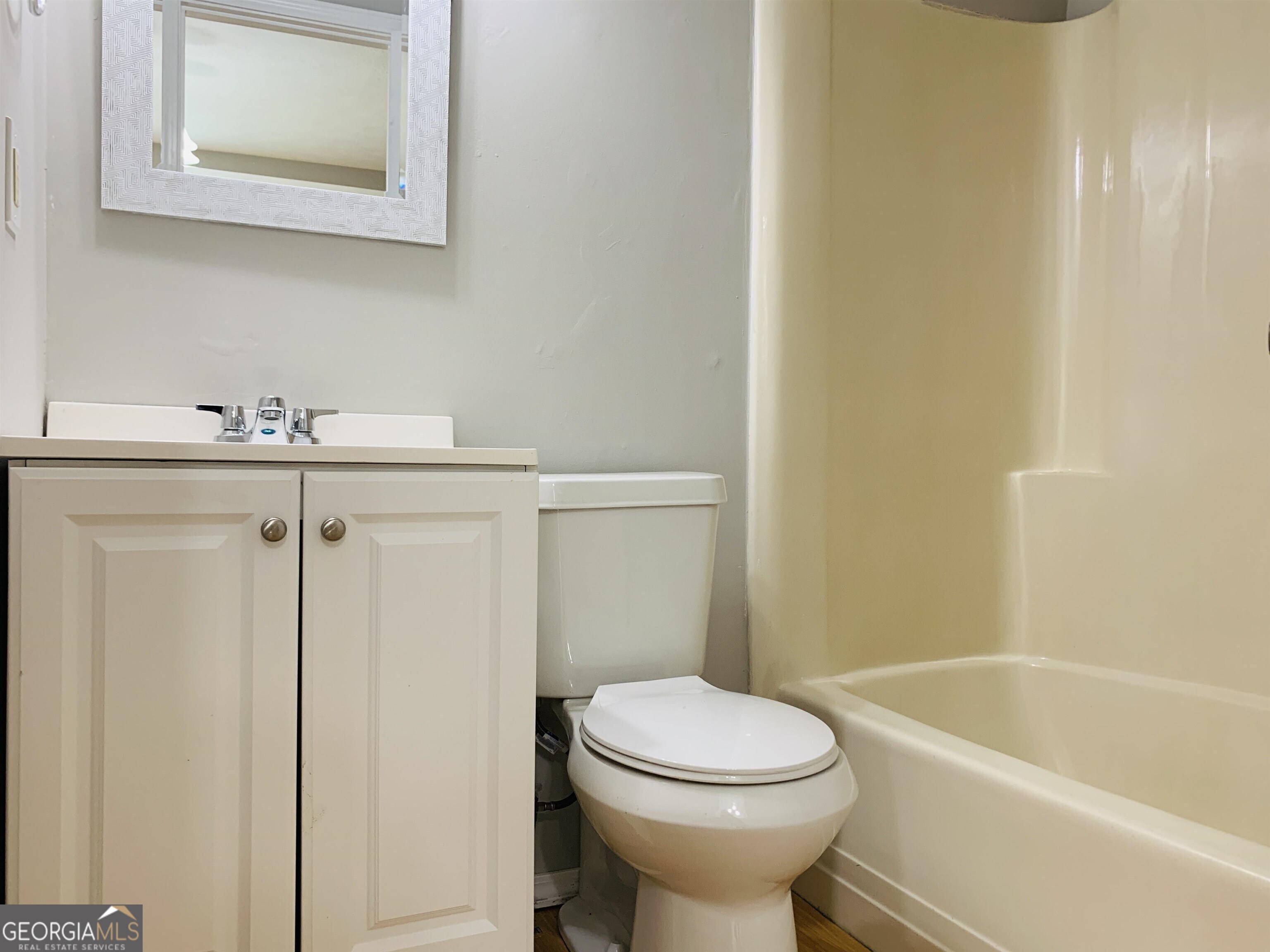 7 Burdette Place, Unit A Newnan, GA 30263 - Photo 11 of 18 a bathroom with a sink a toilet and bathtub