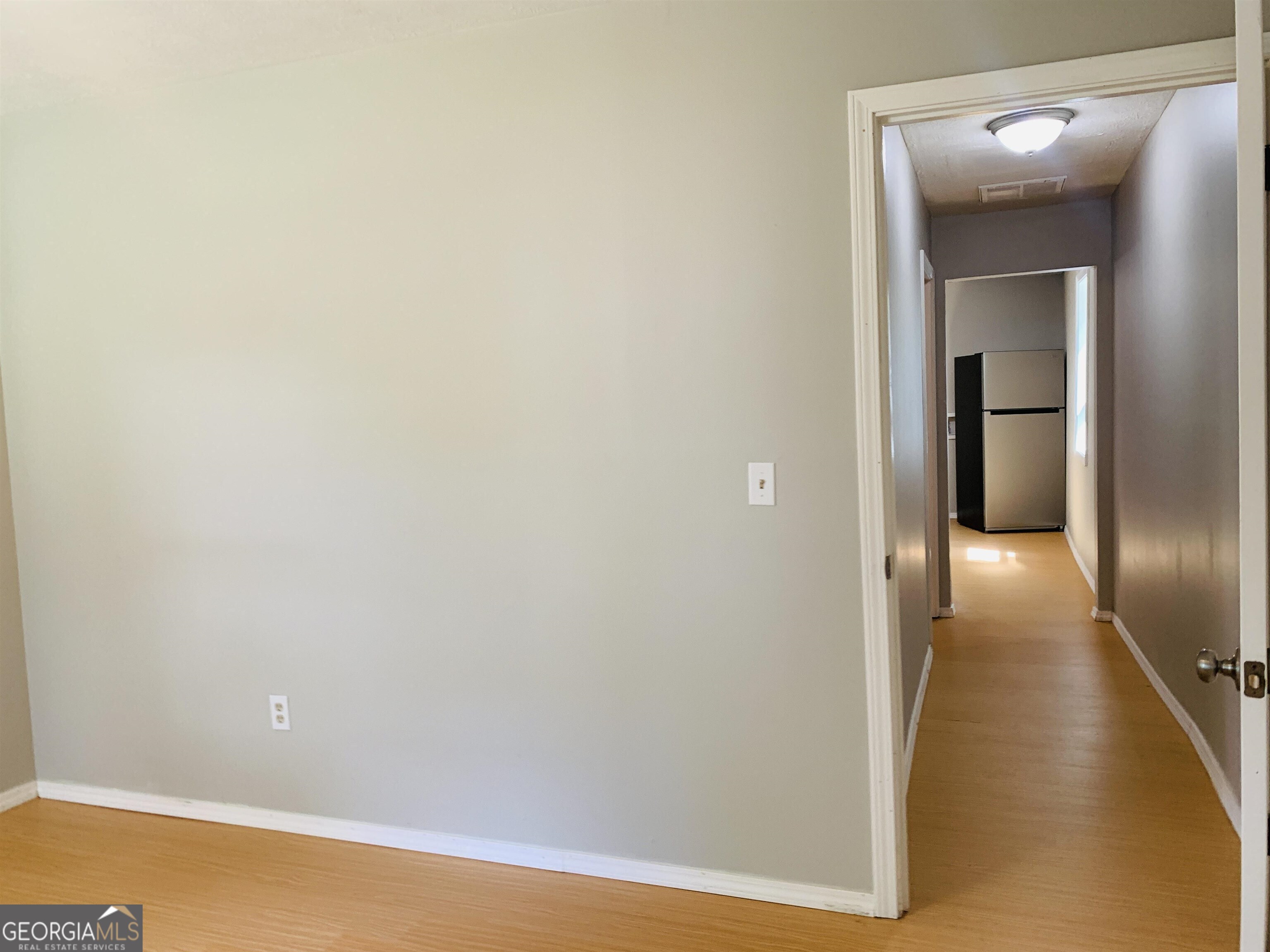 7 Burdette Place, Unit A Newnan, GA 30263 - Photo 15 of 18 a view of a hallway with wooden floor