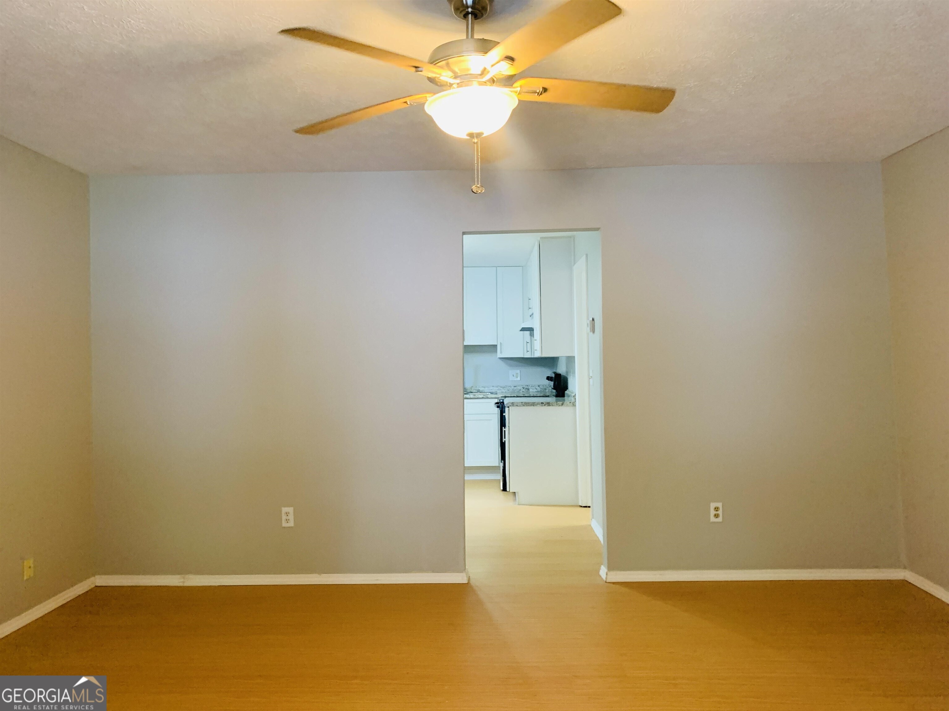 7 Burdette Place, Unit A Newnan, GA 30263 - Photo 4 of 18 a view of a room with a ceiling fan and closet