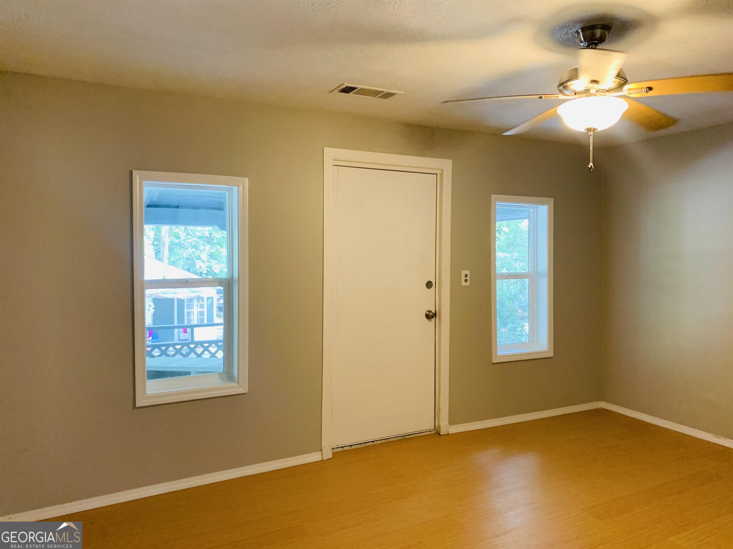 7 Burdette Place, Unit A Newnan, GA 30263 - Photo 6 of 18 a view of an empty room with a window