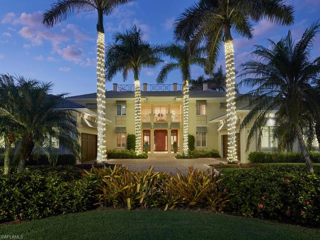 377 Pirates Bight Naples, FL 34103 - Photo 5 of 44 a view of a house with palm trees