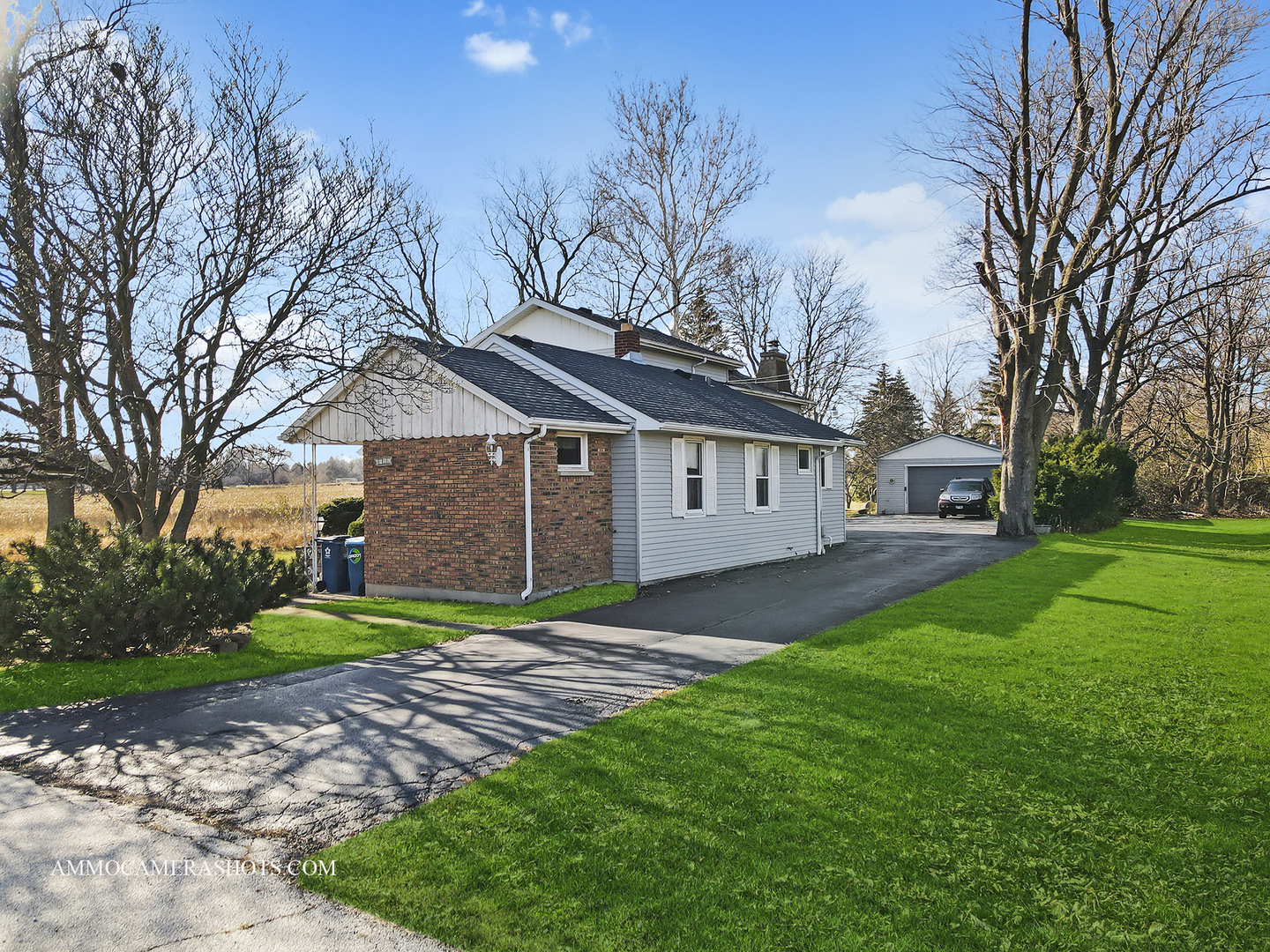 2020 Church Road Aurora, IL 60505 - Photo 5 of 37 a view of a yard in front of a brick house with large windows
