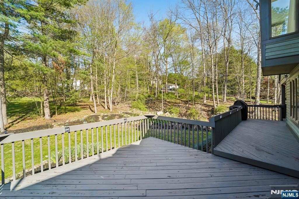 11 Carlough Road Upper Saddle River, NJ 07458 - Photo 36 of 41 a view of a balcony with wooden floor and fence