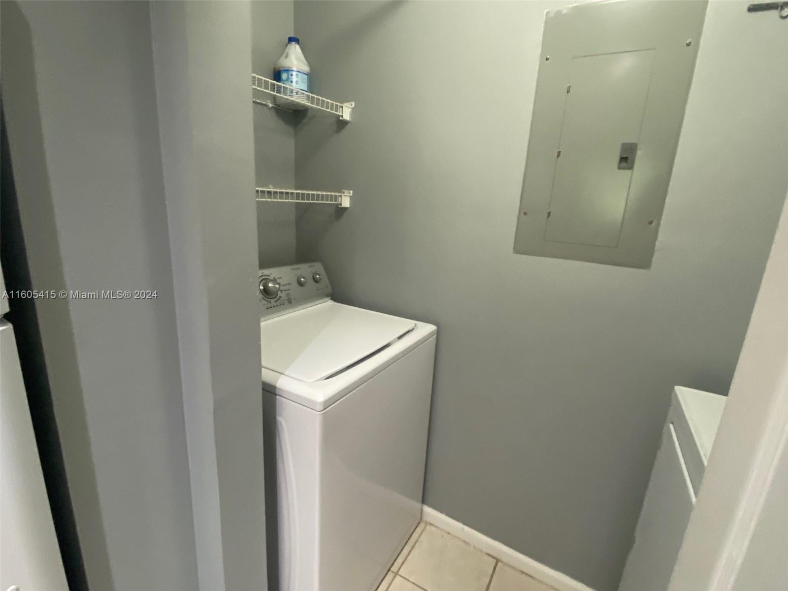 8050 North Nob Hill Road, Unit 201 Tamarac, FL 33321 - Photo 11 of 16 a utility room with dryer and washer