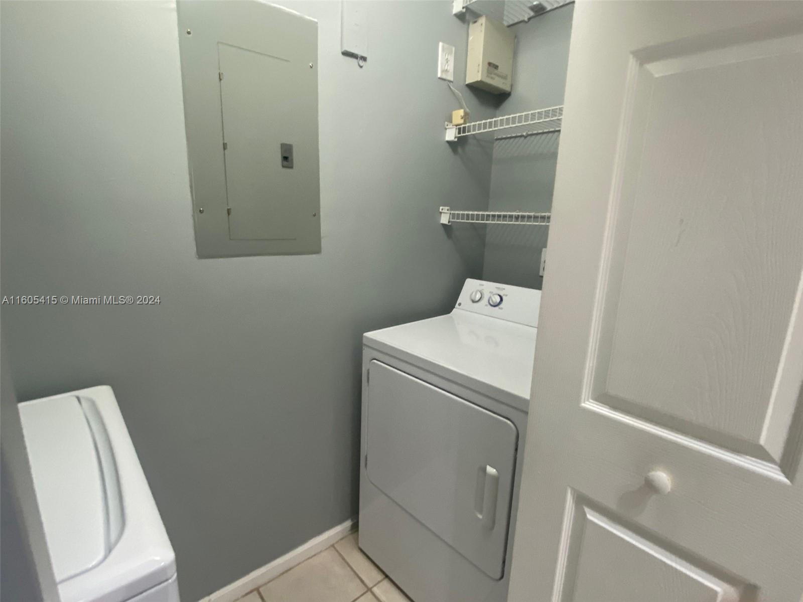 8050 North Nob Hill Road, Unit 201 Tamarac, FL 33321 - Photo 10 of 16 a utility room with dryer and washer