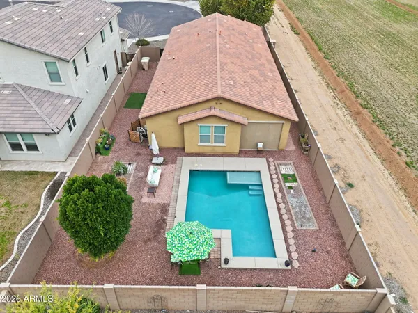 an aerial view of residential houses with outdoor space