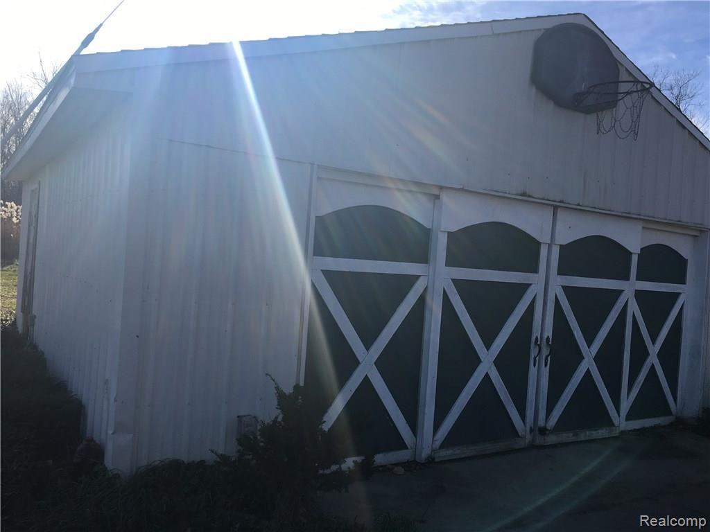 8451 Wiggins Road Howell, MI 48855 - Photo 22 of 23 Detached 2 car garage with barn style doors.
