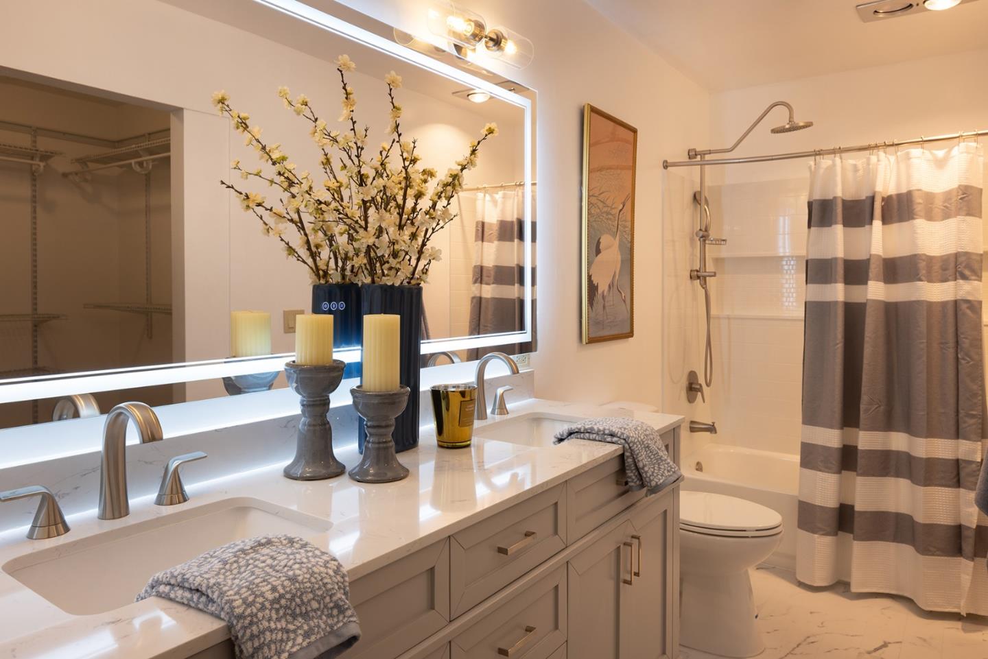 3850 Rio Road, Unit 63 Carmel, CA 93923 - Photo 12 of 19 a bathroom with a double vanity sink toilet and shower
