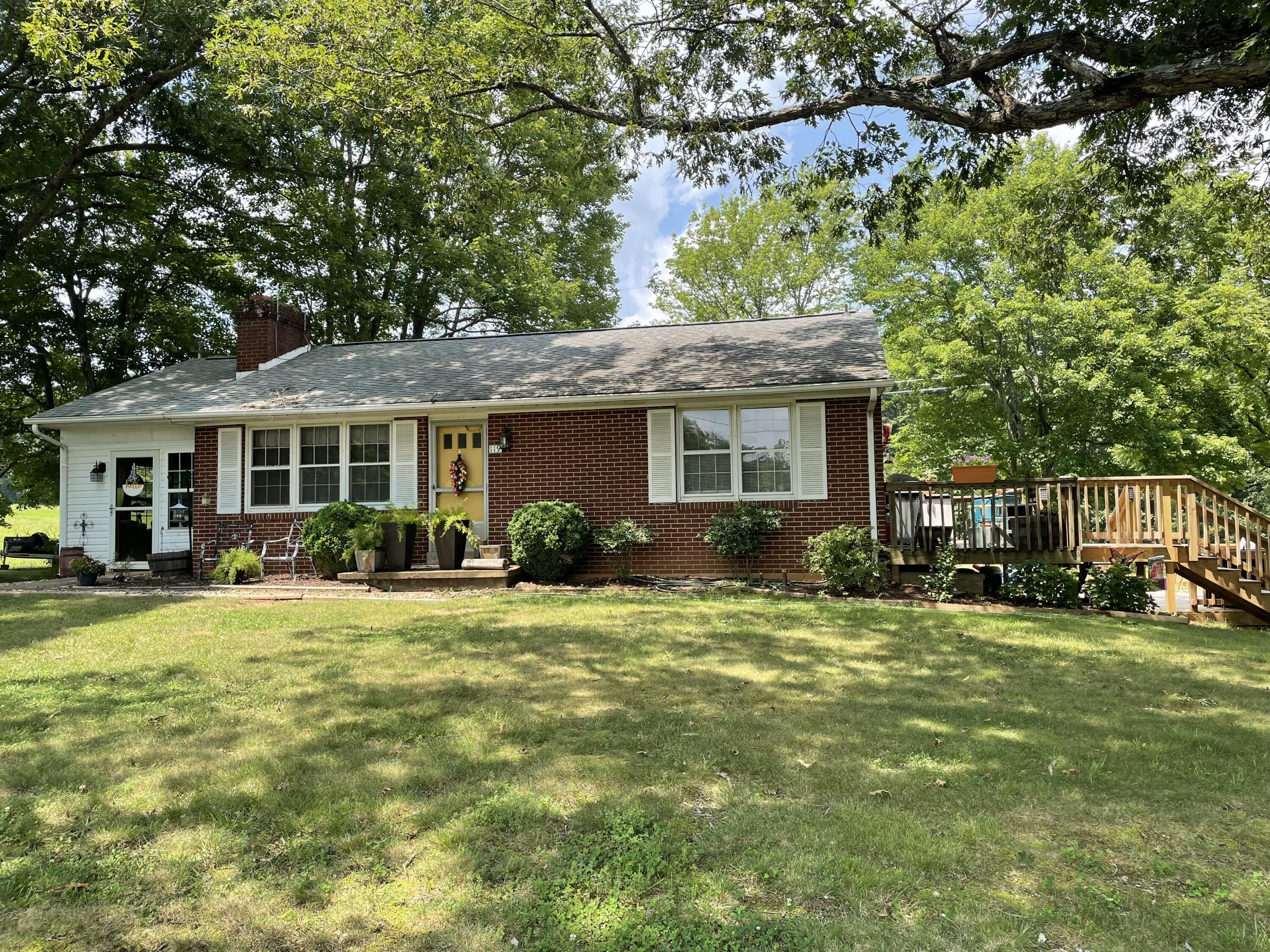 119 Robertson Ridge Road Axton, VA 24054 - Photo 14 of 25 a front view of a house with a garden