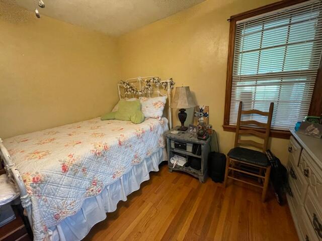 119 Robertson Ridge Road Axton, VA 24054 - Photo 4 of 25 a bed sitting in a bedroom next to a window
