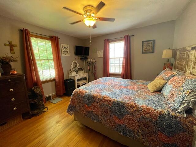 119 Robertson Ridge Road Axton, VA 24054 - Photo 6 of 25 a bedroom with a bed dresser and a window