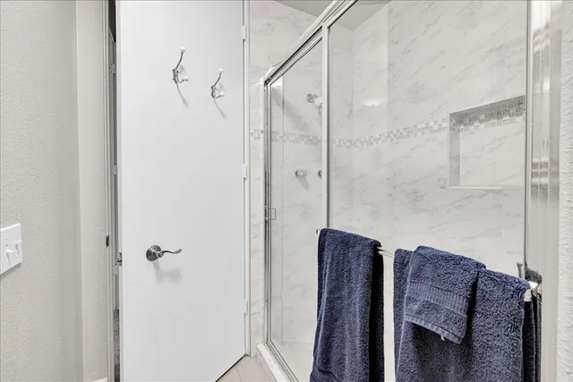 a view of living room with furniture and a mirror