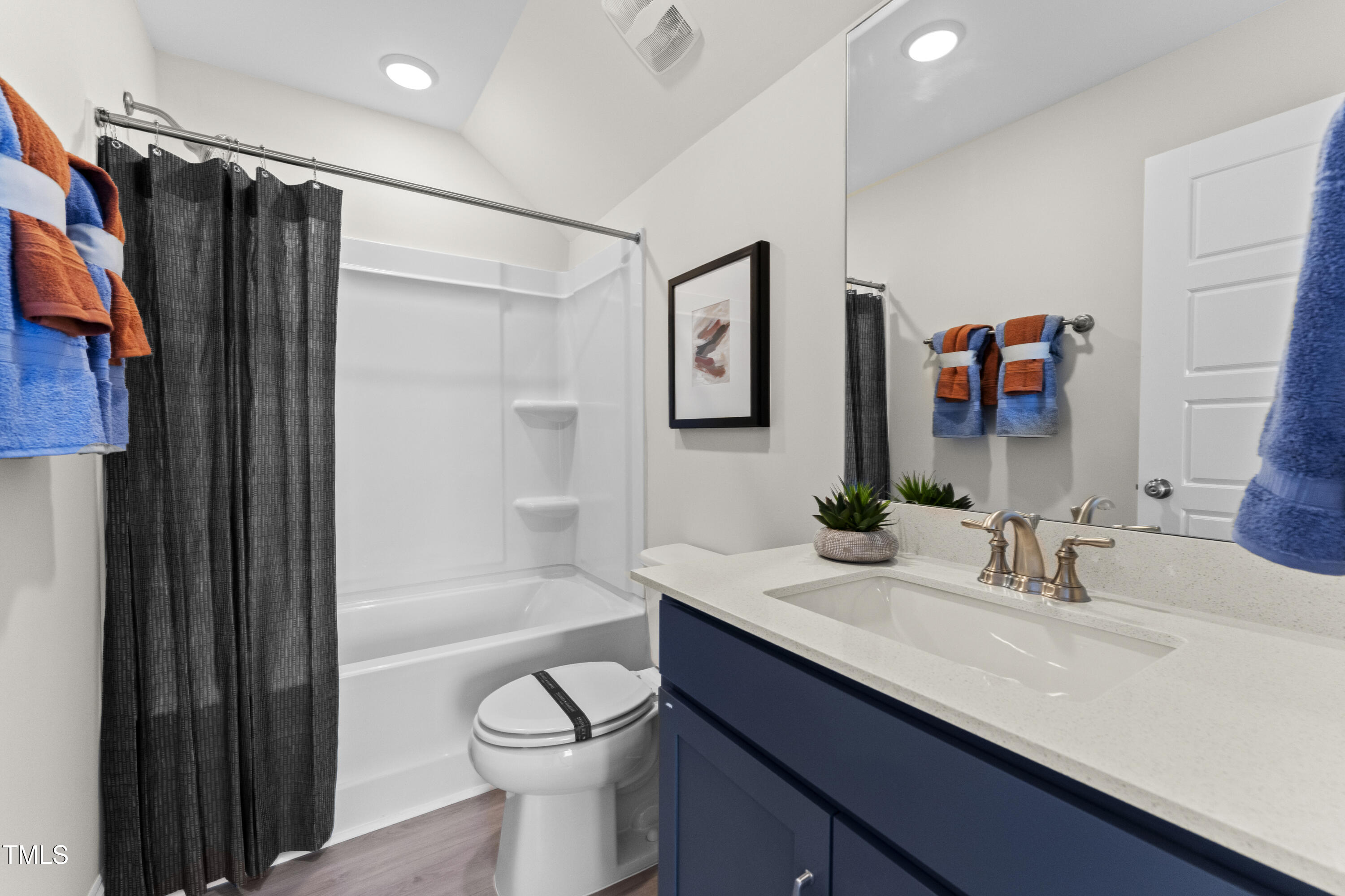 2722 Kempthorne Road Cary, NC 27519 - Photo 11 of 40 a bathroom with a sink a toilet and shower
