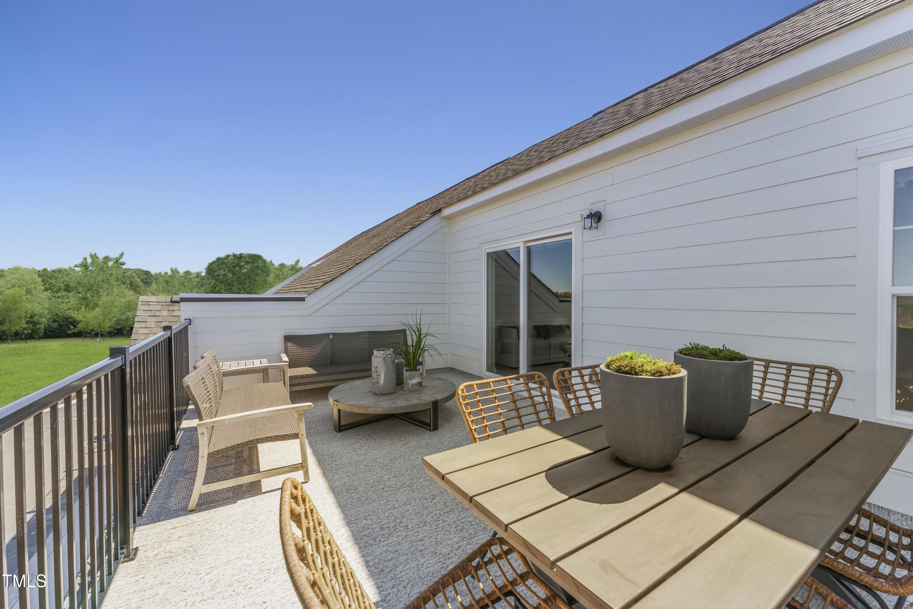 2722 Kempthorne Road Cary, NC 27519 - Photo 2 of 40 a view of a patio on the roof deck