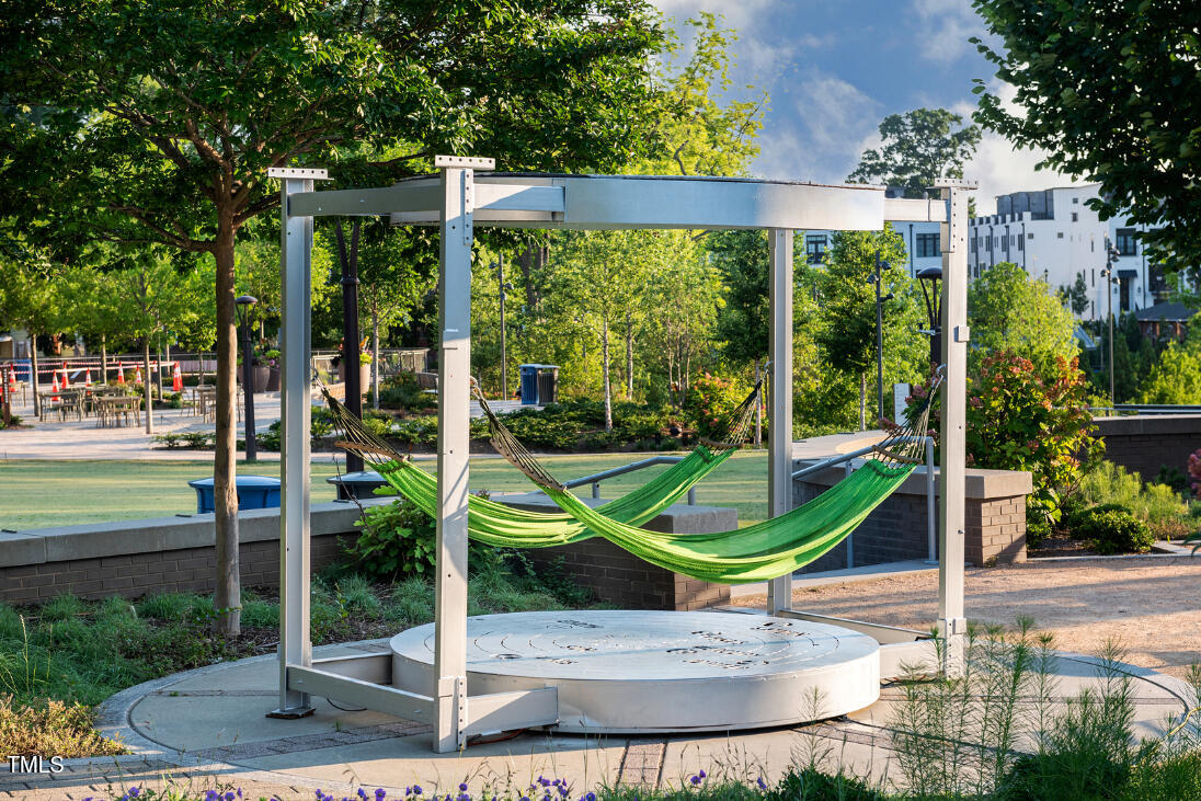 2722 Kempthorne Road Cary, NC 27519 - Photo 30 of 40 a park view with a bench in the patio