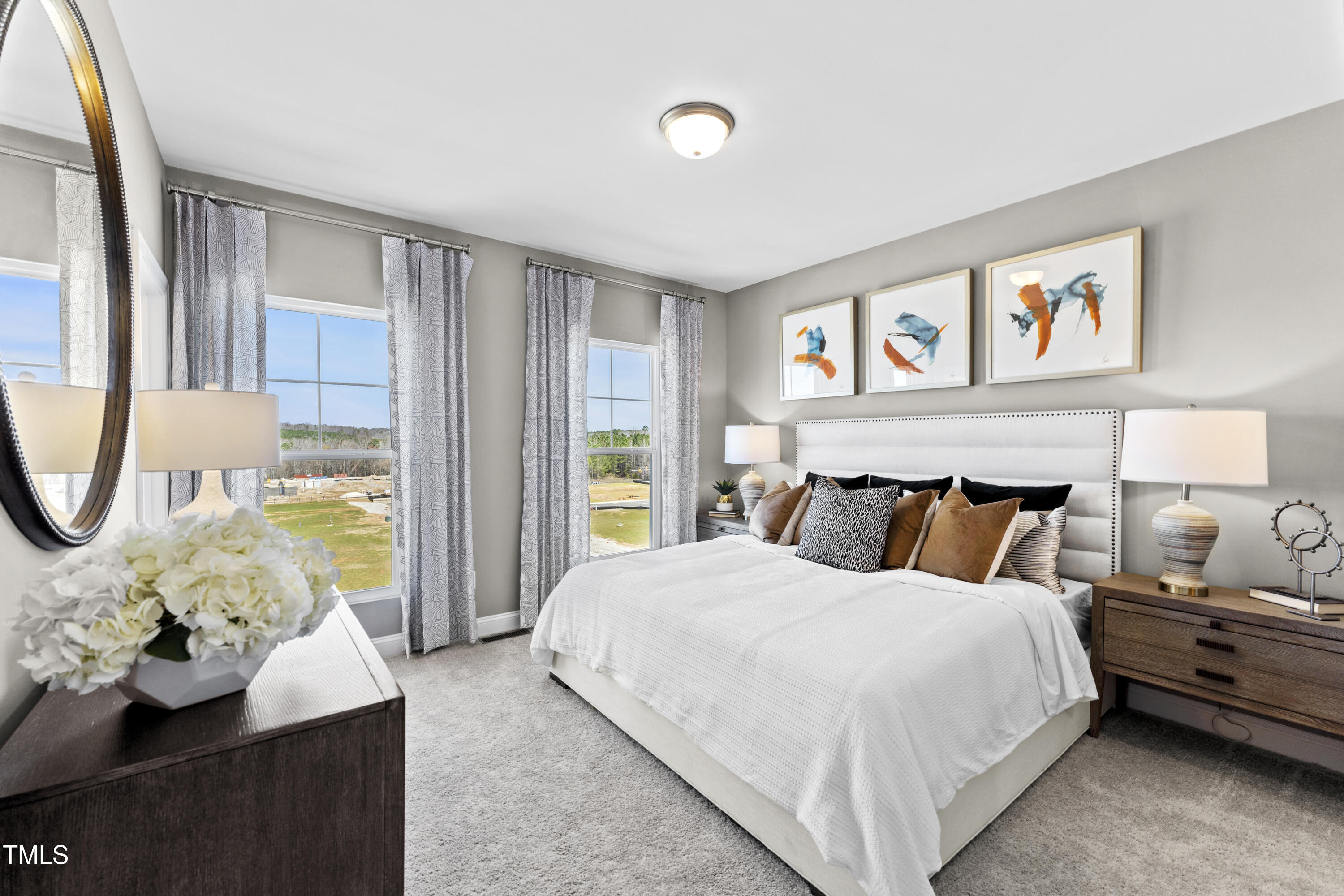 2722 Kempthorne Road Cary, NC 27519 - Photo 5 of 40 a bedroom with a bed and a large window