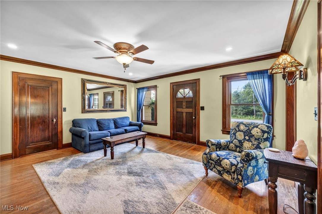 7550 Mayfield Road Chesterland, OH 44026 - Photo 22 of 45 Living area with ornamental molding, a ceiling fan, wood finished floors, and recessed lighting