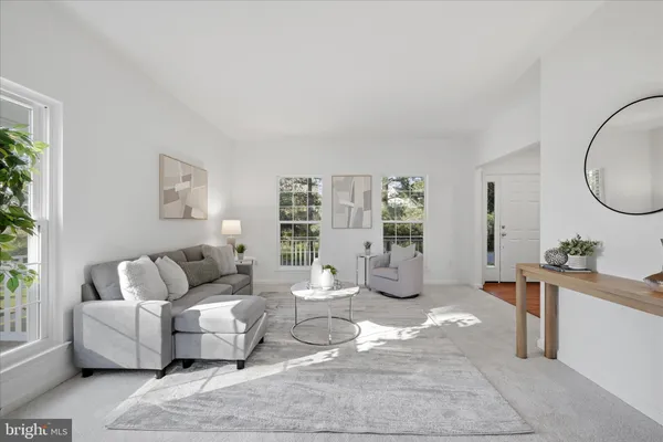 a spacious bathroom with a double vanity sink a large mirror and a bathtub