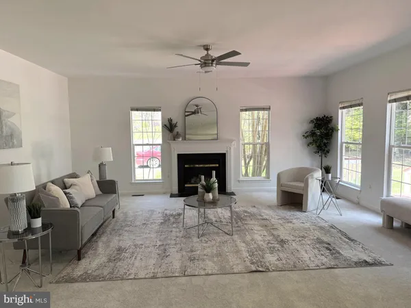 a view of yard with swimming pool and green space
