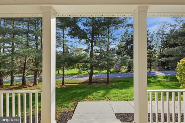 a living room with furniture white walls and a fireplace