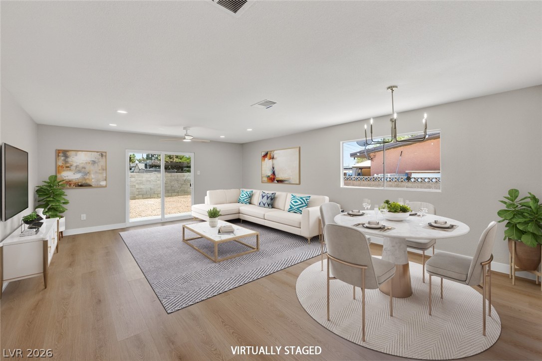 2484 Anglia Street Las Vegas, NV 89142 - Photo 8 of 20 This bright, open-concept living space offers abundant natural light and seamless indoor-outdoor flow.