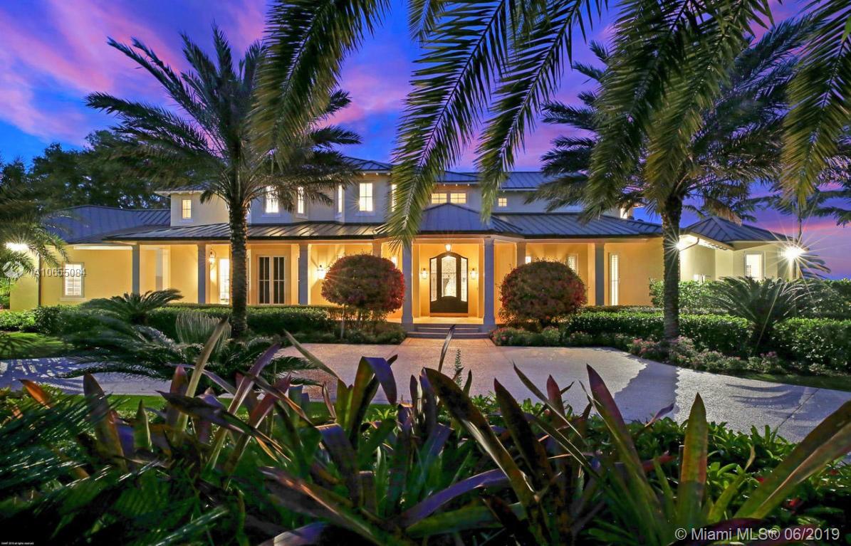 5241 Pennock Point Road Jupiter, FL 33458 - Photo 11 of 51 a view of a swimming pool with a patio