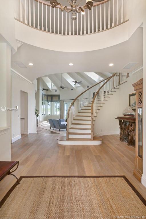 5241 Pennock Point Road Jupiter, FL 33458 - Photo 17 of 51 a view of entryway and hall with wooden floor