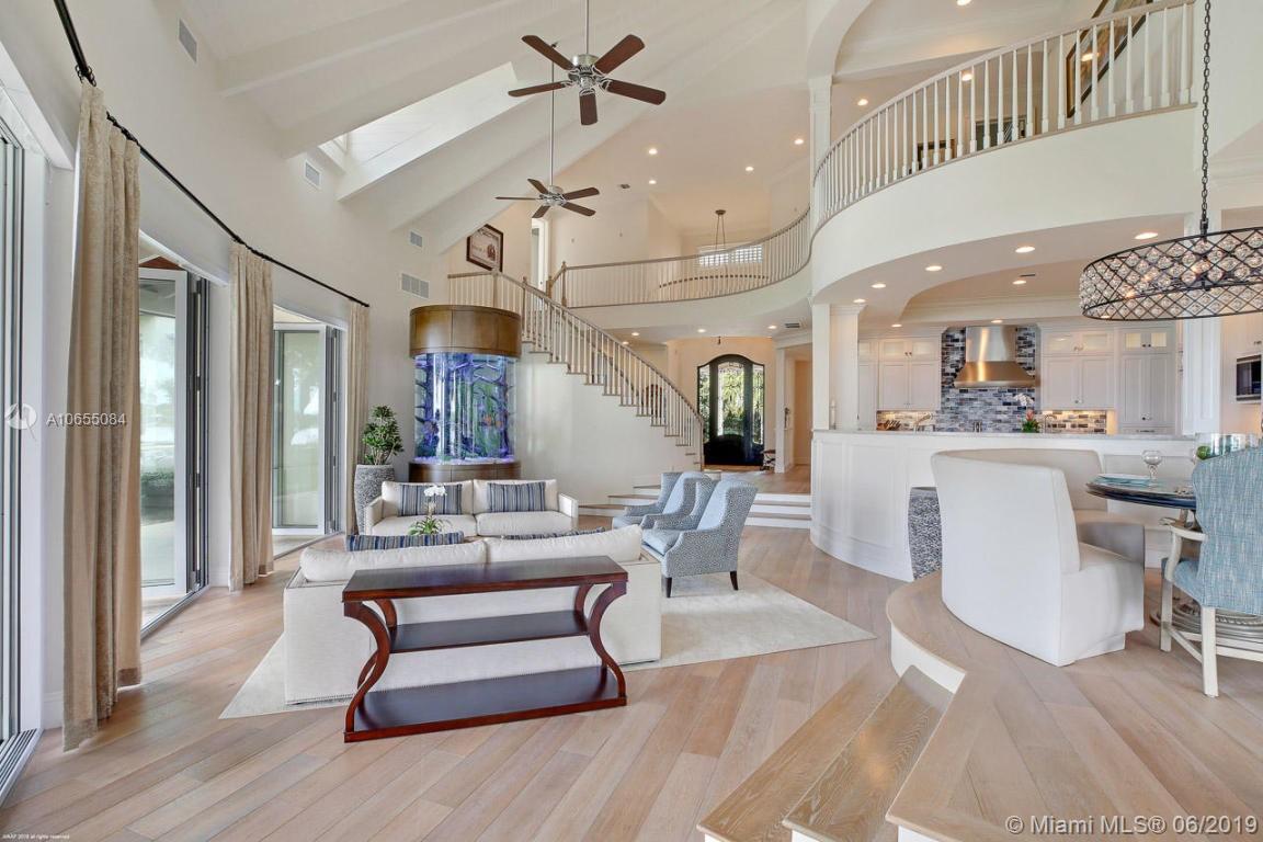 5241 Pennock Point Road Jupiter, FL 33458 - Photo 18 of 51 a living room with furniture a rug and white walls