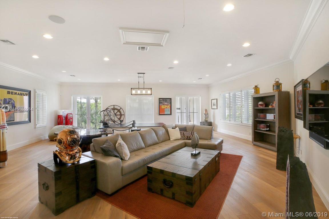 5241 Pennock Point Road Jupiter, FL 33458 - Photo 28 of 51 a living room with furniture and wooden floor
