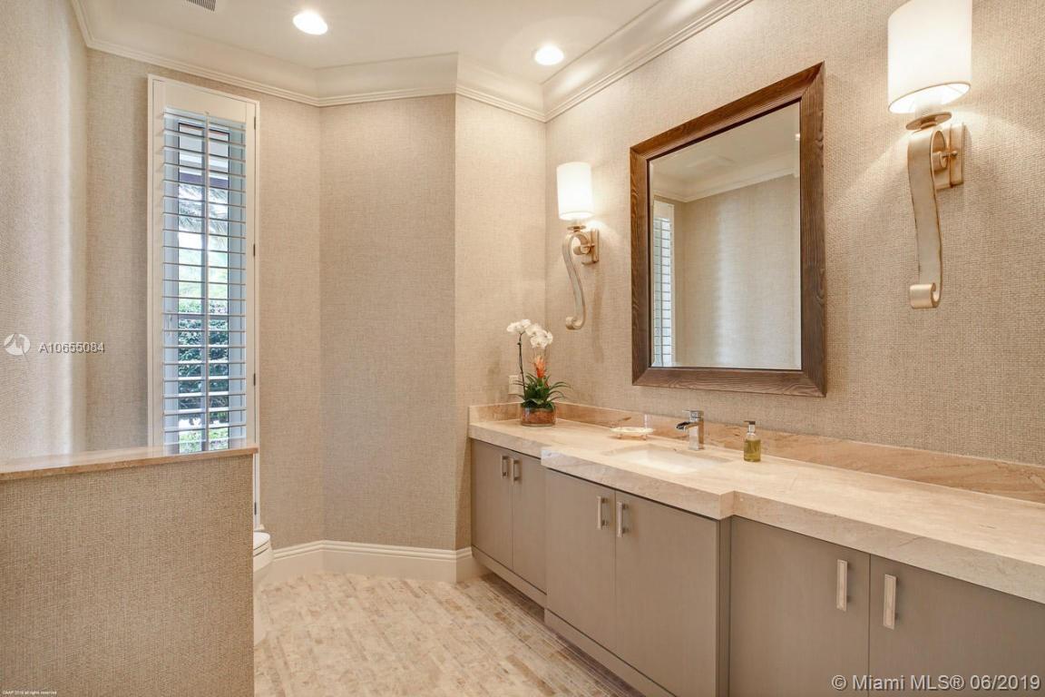 5241 Pennock Point Road Jupiter, FL 33458 - Photo 29 of 51 a bathroom with a double vanity sink and a mirror