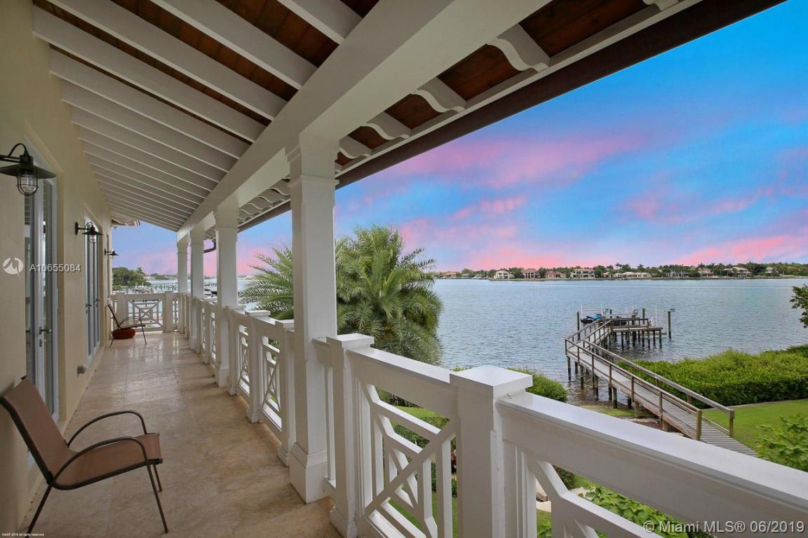 5241 Pennock Point Road Jupiter, FL 33458 - Photo 31 of 51 a view of a balcony with chairs and a table