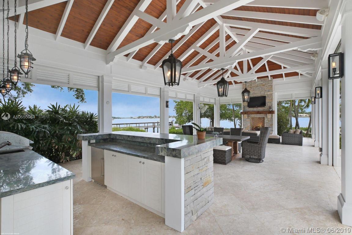 5241 Pennock Point Road Jupiter, FL 33458 - Photo 36 of 51 a view of a kitchen with furniture and a potted plant