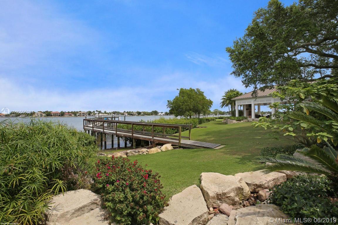 5241 Pennock Point Road Jupiter, FL 33458 - Photo 46 of 51 a view of a house with a yard