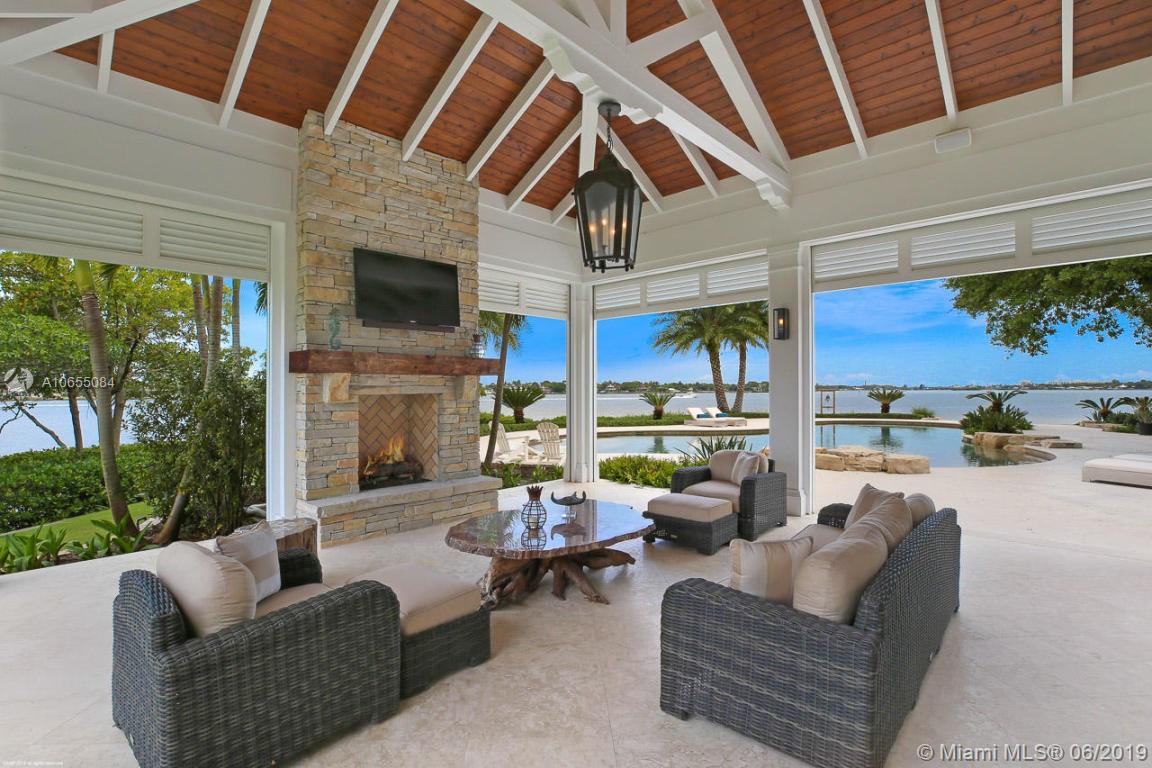 5241 Pennock Point Road Jupiter, FL 33458 - Photo 5 of 51 a outdoor living space with patio furniture and a fireplace