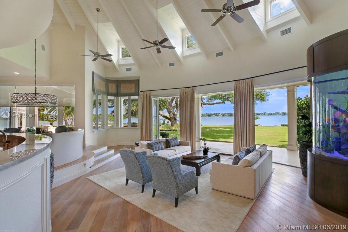 5241 Pennock Point Road Jupiter, FL 33458 - Photo 7 of 51 a living room with furniture and large windows