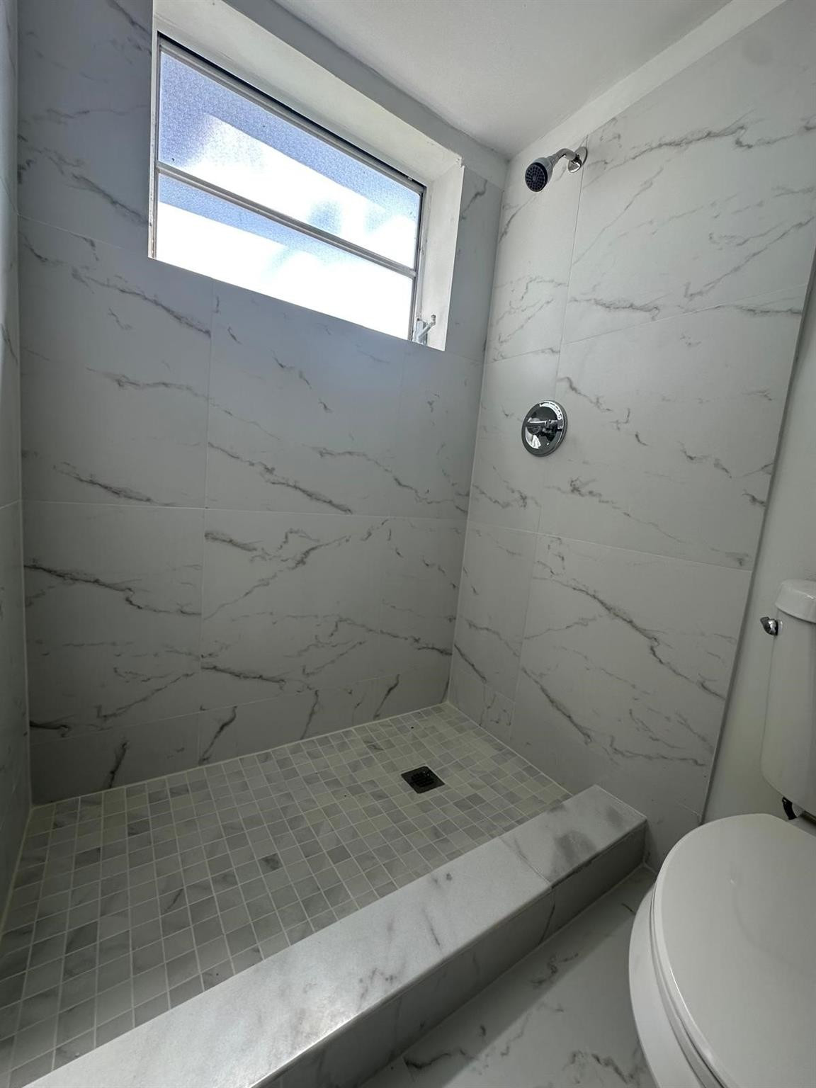 7330 Southwest 82nd Street, Unit B115 Miami, FL 33143 - Photo 12 of 19 a bathroom with a toilet and a shower