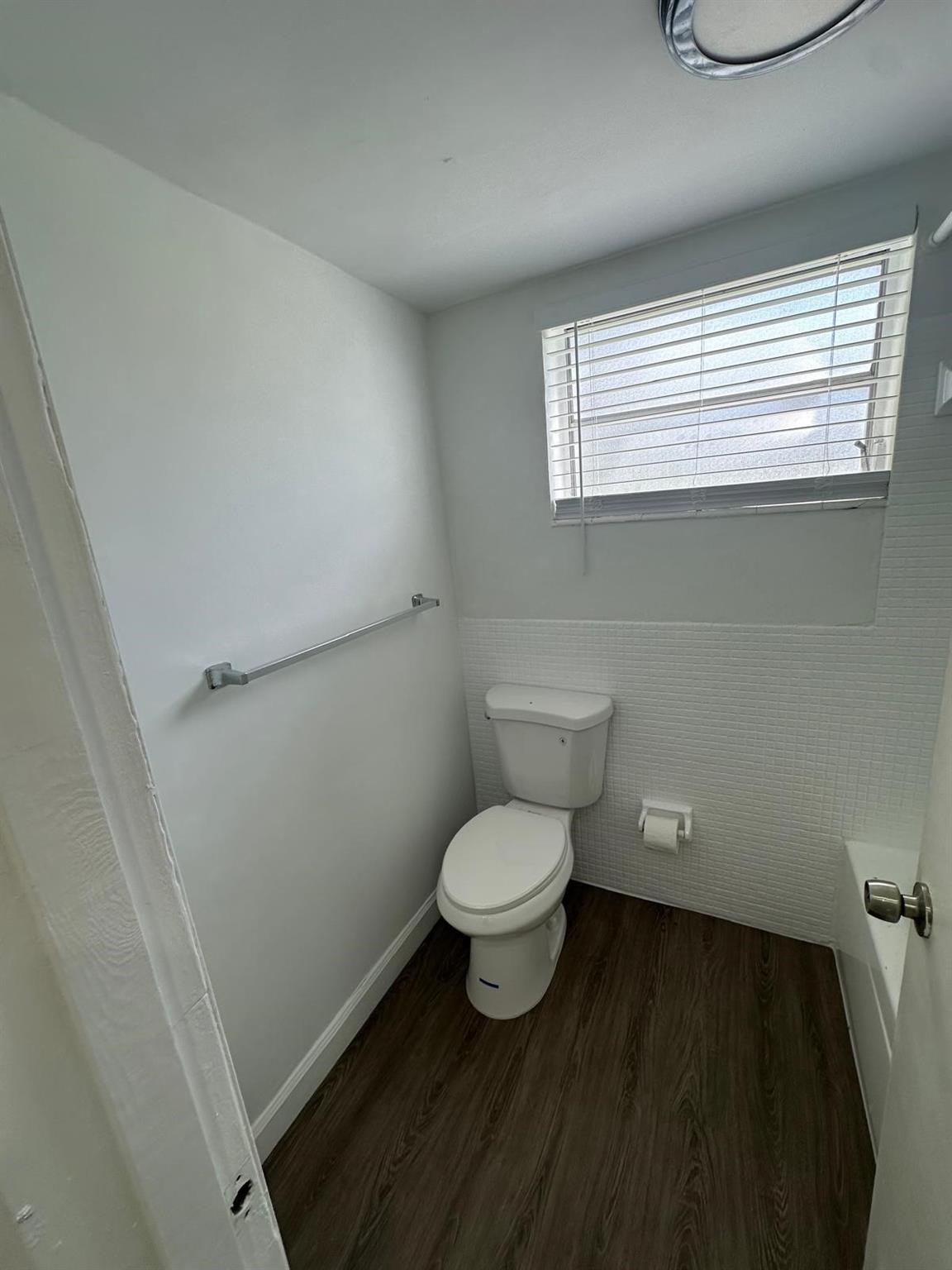 7330 Southwest 82nd Street, Unit B115 Miami, FL 33143 - Photo 15 of 19 a bathroom with a toilet a sink and a window