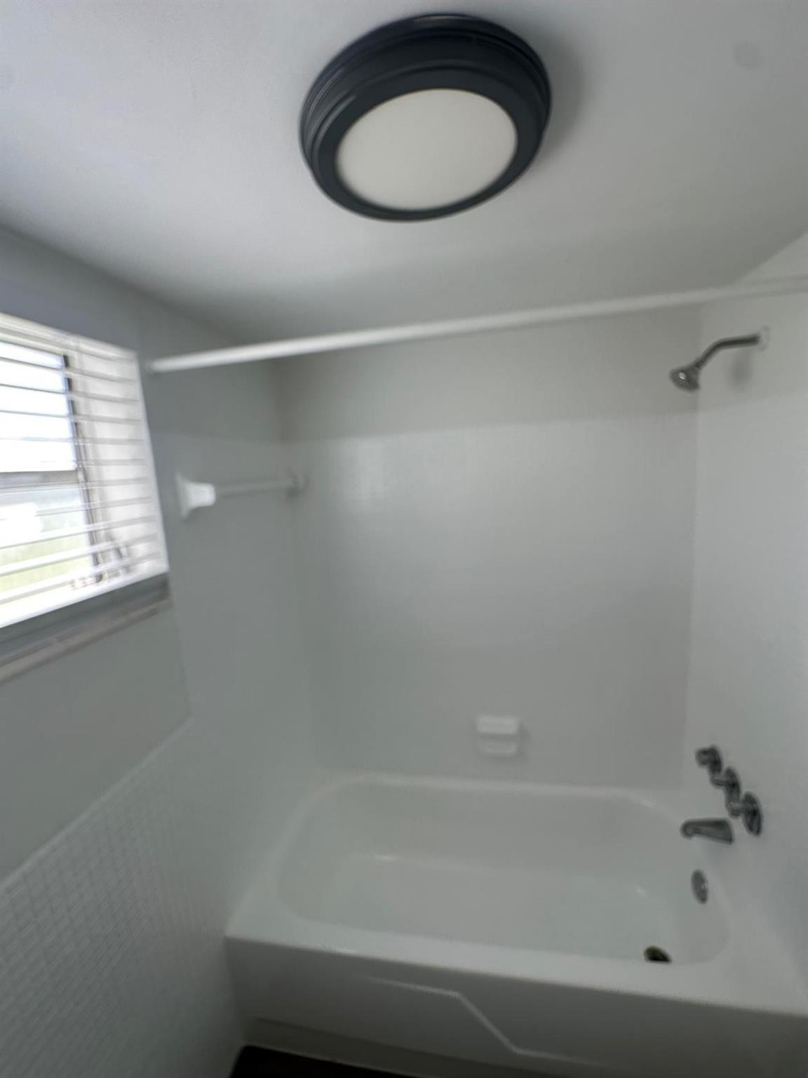 7330 Southwest 82nd Street, Unit B115 Miami, FL 33143 - Photo 16 of 19 a bathroom with a bathtub