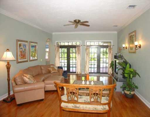 12 Rio Vista Drive Stuart, FL 34996 - Photo 3 of 8 a living room with furniture and a large window