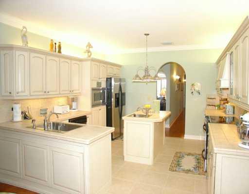 12 Rio Vista Drive Stuart, FL 34996 - Photo 6 of 8 a kitchen with a sink and cabinets