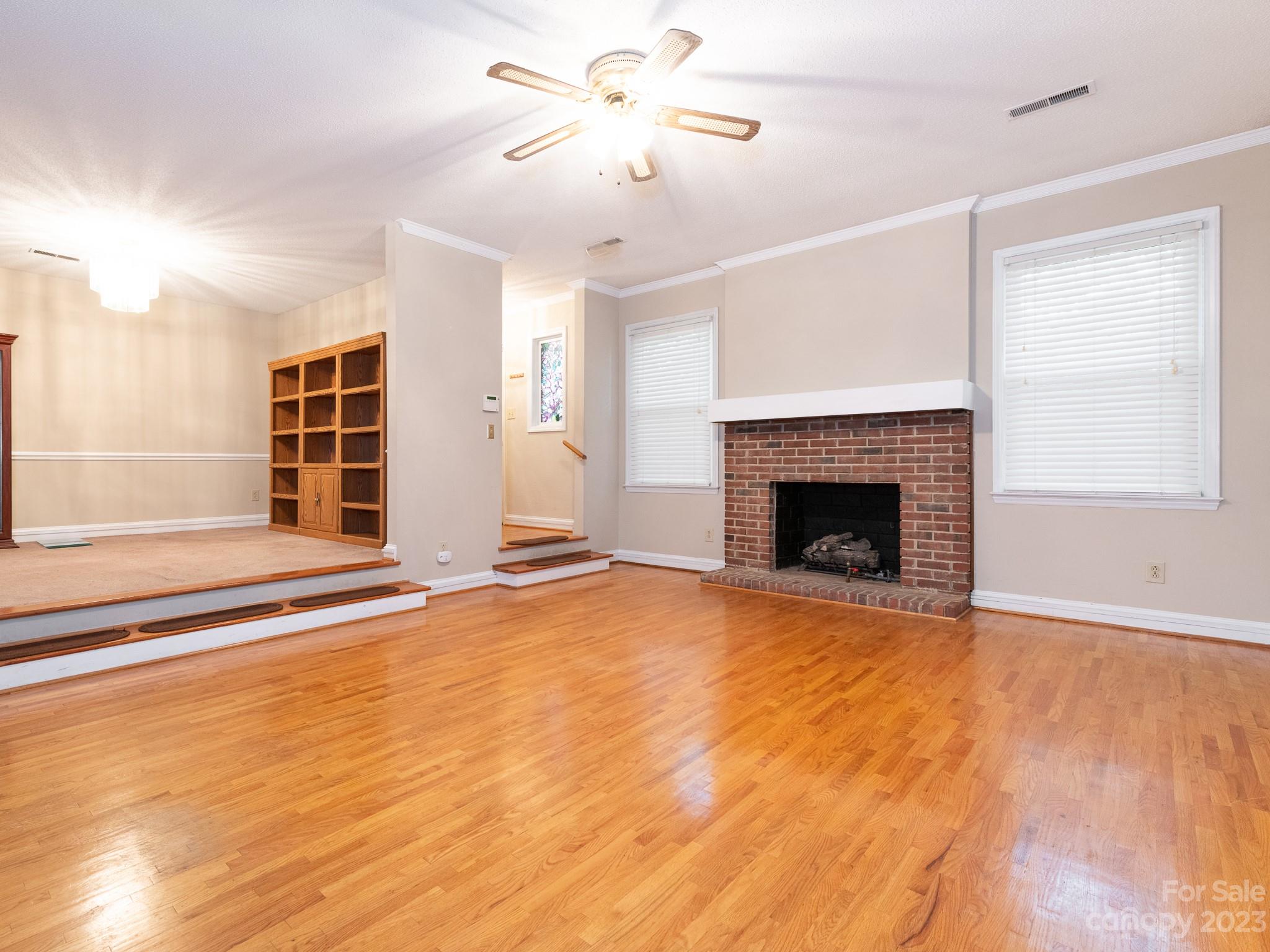 2502 Round Table Road, Unit A Monroe, NC 28110 - Photo 2 of 34 a view of empty room with wooden floor and fireplace