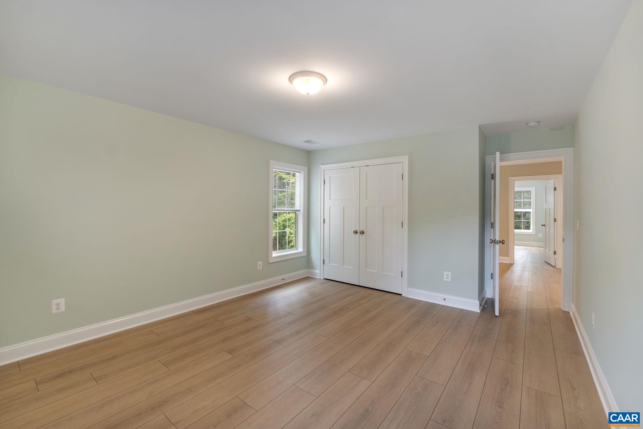 57-22a Old Three Notch'd Road Charlottesville, VA 22901 - Photo 11 of 27 wooden floor in an empty room with a window