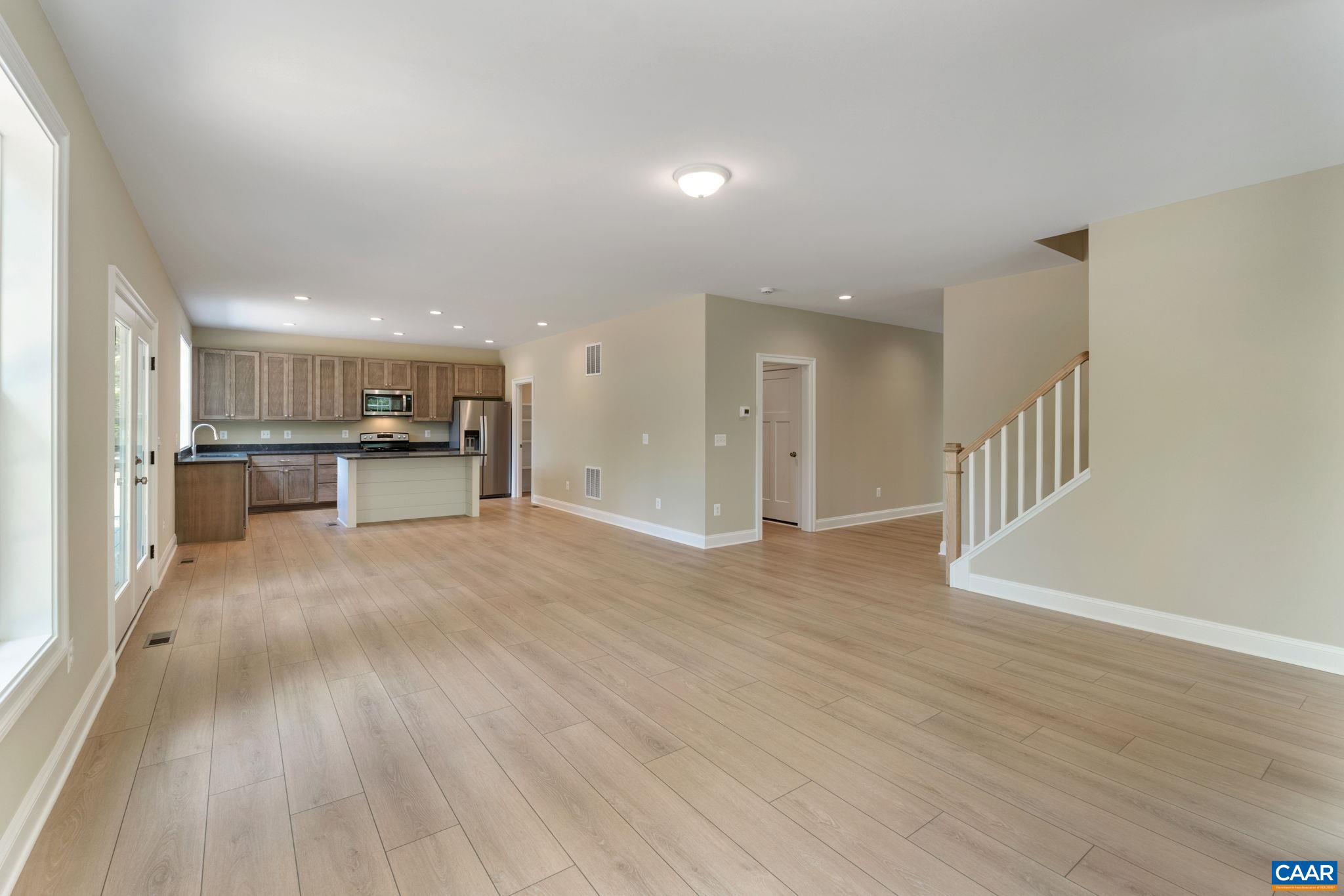 57-22a Old Three Notch'd Road Charlottesville, VA 22901 - Photo 21 of 27 a view of a kitchen with a sink and a refrigerator