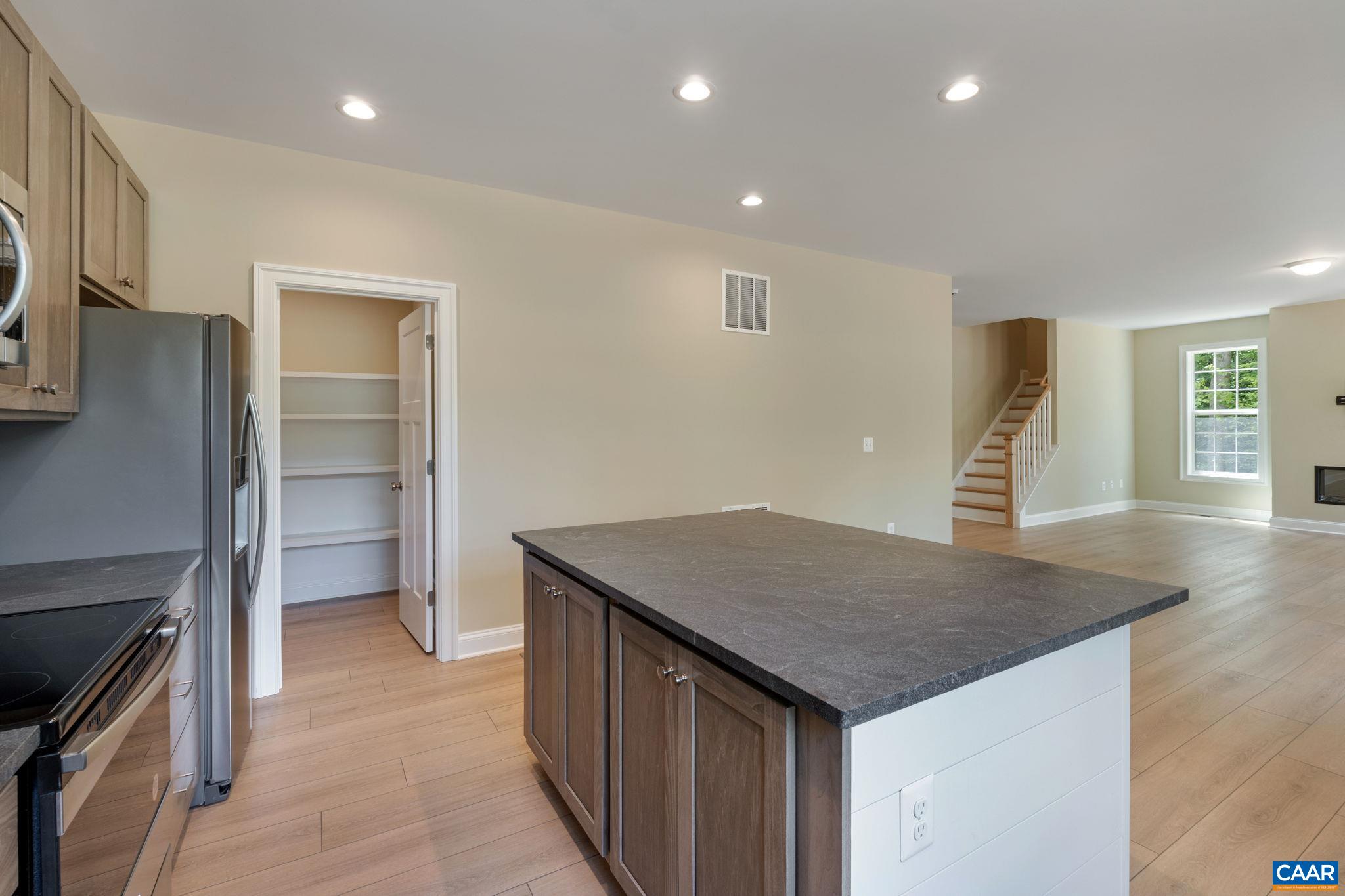 57-22a Old Three Notch'd Road Charlottesville, VA 22901 - Photo 5 of 27 a kitchen that has a island in it