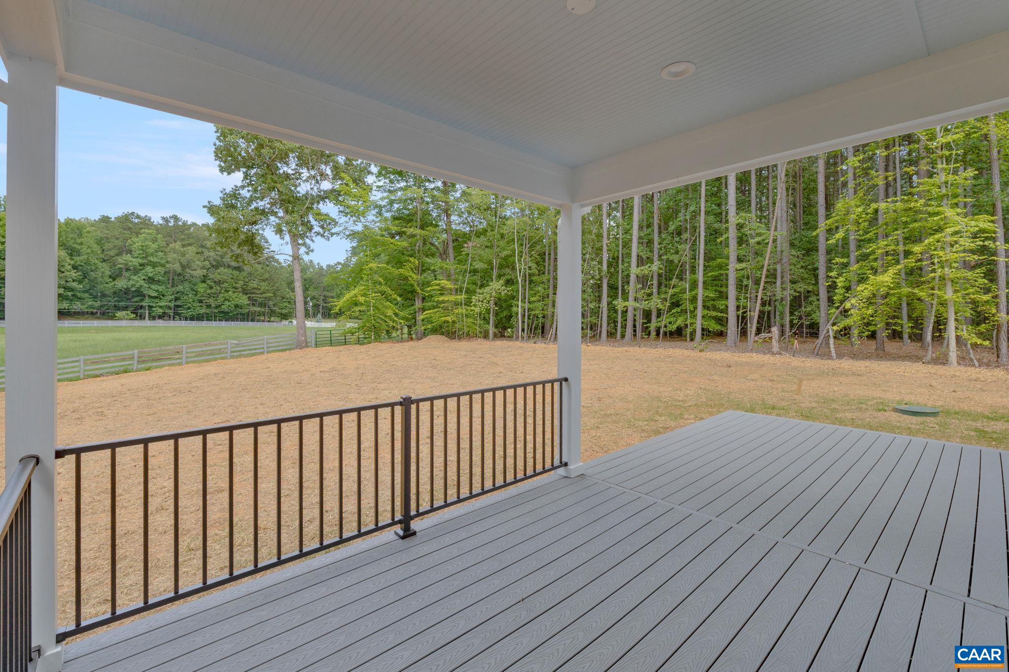 57-22a Old Three Notch'd Road Charlottesville, VA 22901 - Photo 8 of 27 a view of a room with wooden floor and city view