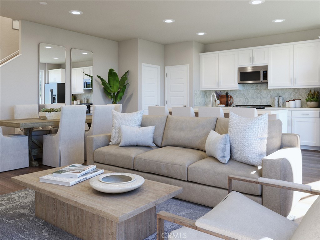 28234 Heirloom Drive Temecula, CA 92591 - Photo 6 of 17 a living room with furniture and a dining table with kitchen view