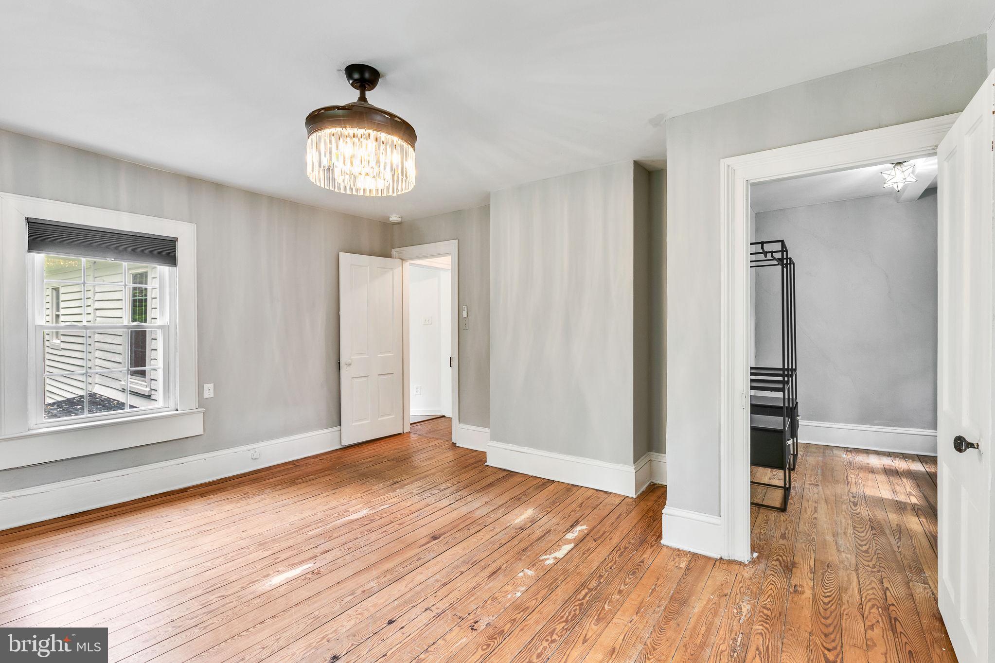 3952 Irvington Road Irvington, VA 22480 - Photo 33 of 77 wooden floor in an empty room with a window
