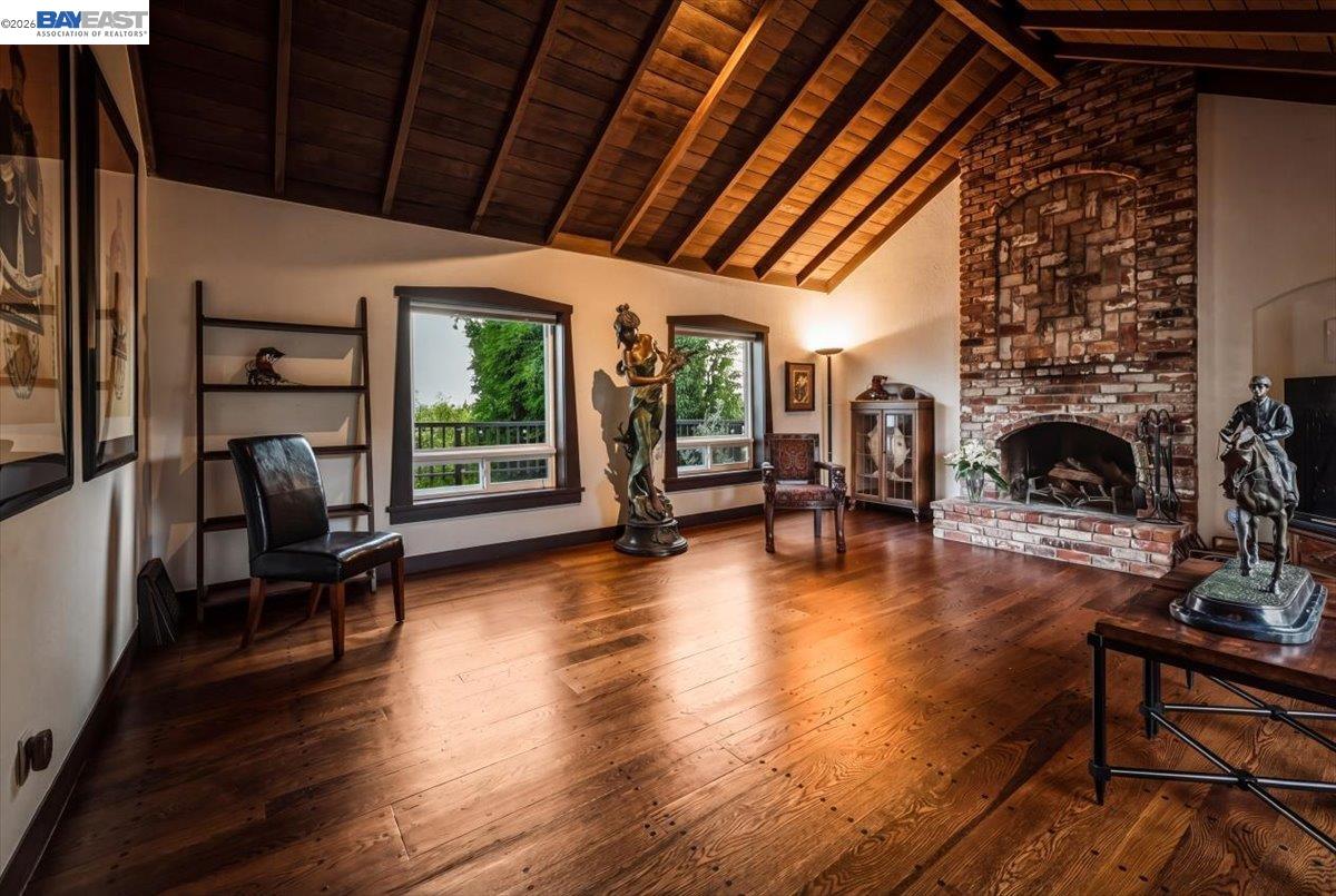 22111 Prospect Street Hayward, CA 94541 - Photo 49 of 70 a living room with fireplace furniture and a wooden floor